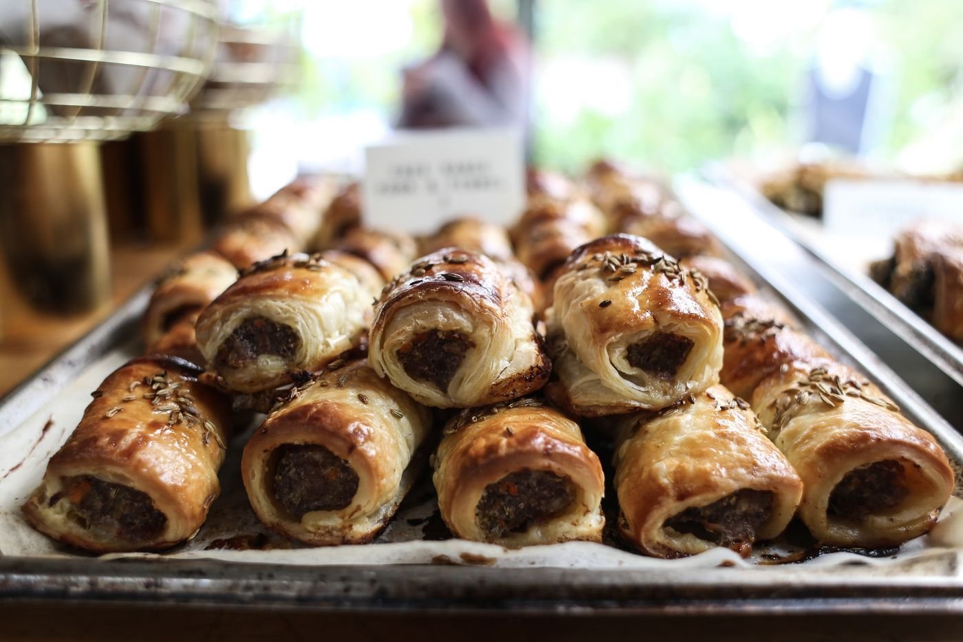 A tray of flaky sausage rolls
